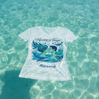 White t-shirt with 'Kissing in Tonga' design floating in clear blue water